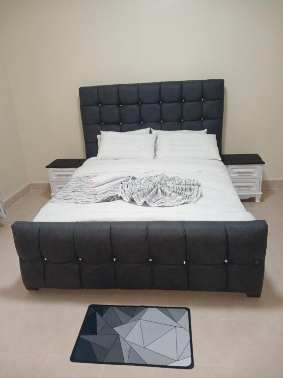 Ένα ή περισσότερα κρεβάτια σε δωμάτιο στο Naka Stafford near Wanjiru's