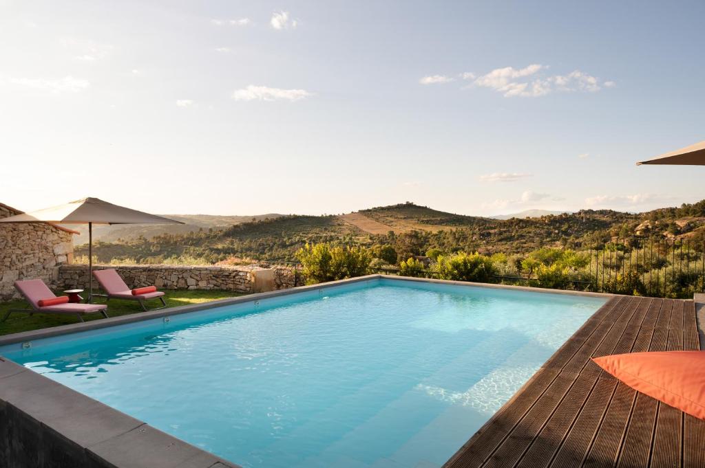 a swimming pool with a view of a mountain at Casa Dr Ramiro Salgado - Douro Superior, Torre de Moncorvo in Torre de Moncorvo