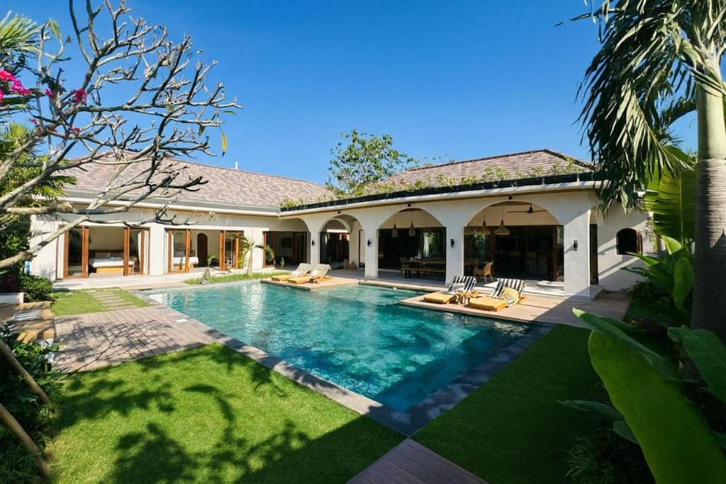 a swimming pool in the backyard of a house at MerSea Villa -Brand new Balangan beach -luxurious 4 bdr with huge pool in Perean