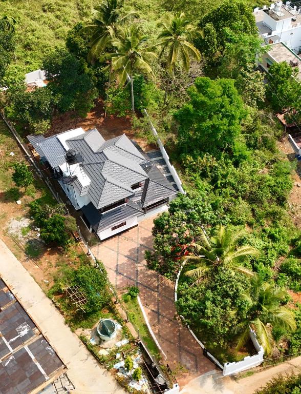 an overhead view of a house with a roof at Tranquil Nest Villa - Wayanad in Kalpetta