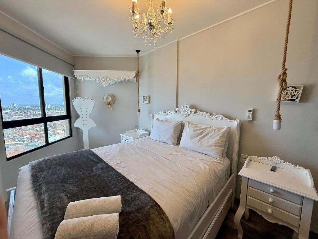 Ένα ή περισσότερα κρεβάτια σε δωμάτιο στο Studio Design 3 Apt 1203 -Mandi Hospitalidade