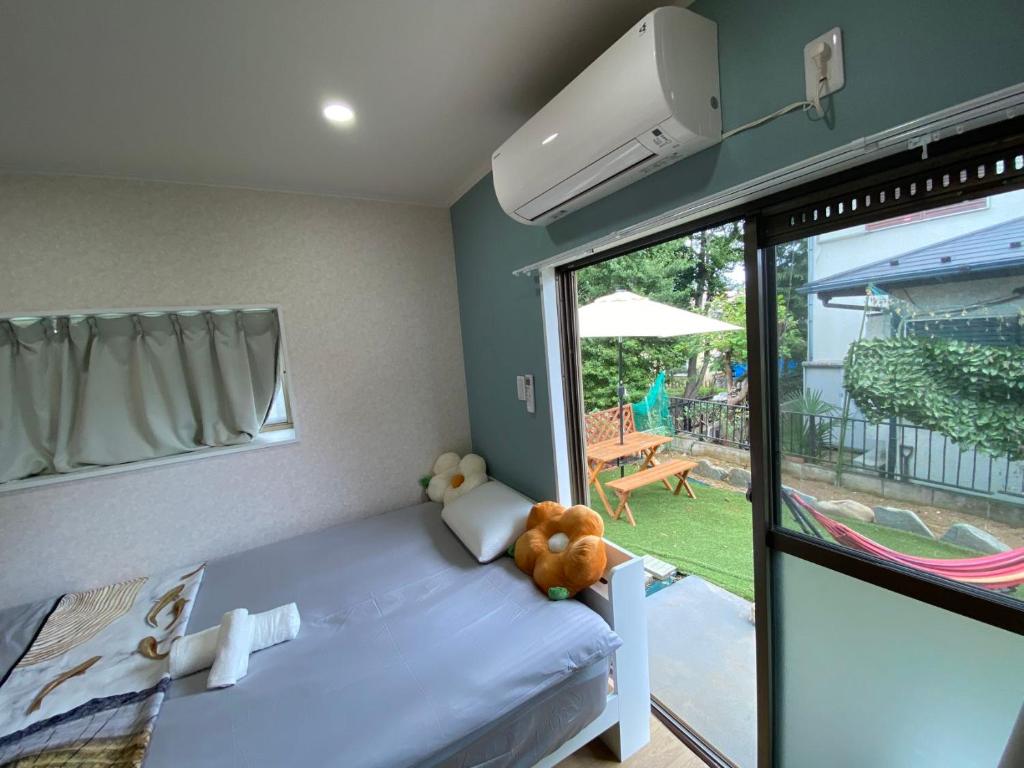 Ένα ή περισσότερα κρεβάτια σε δωμάτιο στο Hiregasaki, Nagareyama 2号