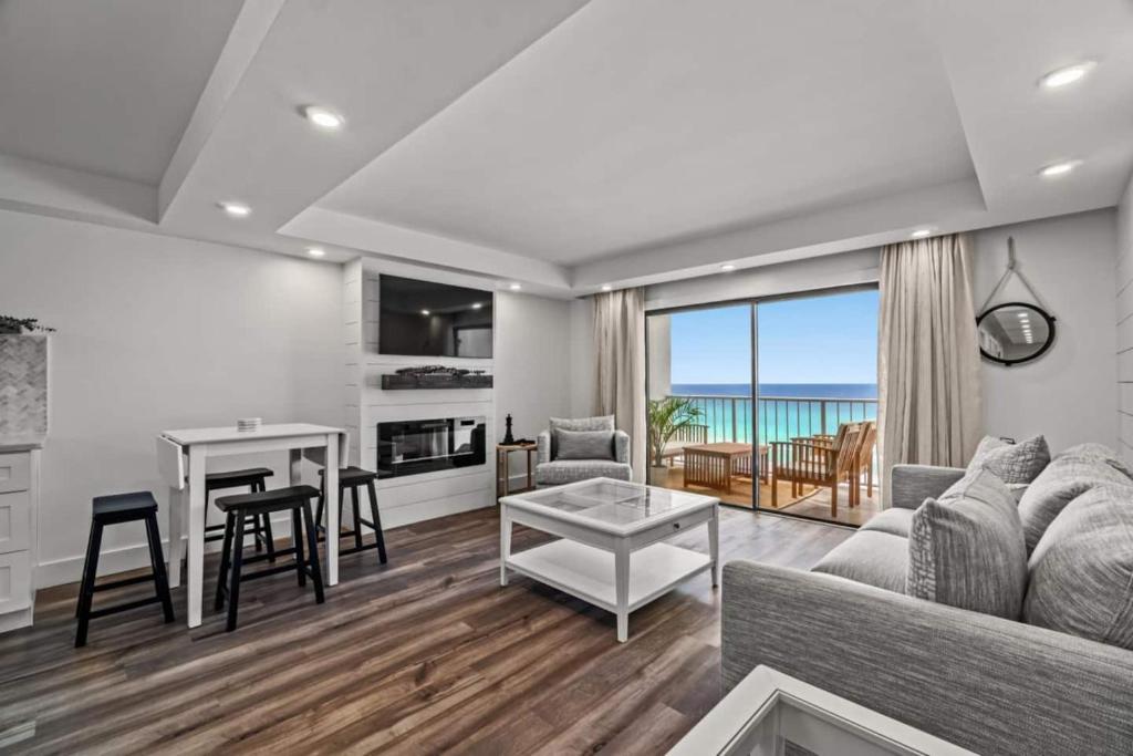 a living room with a couch and a table at Summit 803 - Luxury Beach Resort Condo 1-6 People in Panama City Beach