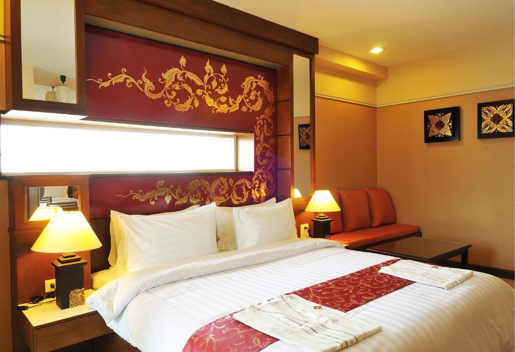 Postel nebo postele na pokoji v ubytování Mariya Boutique Hotel At Suvarnabhumi Airport