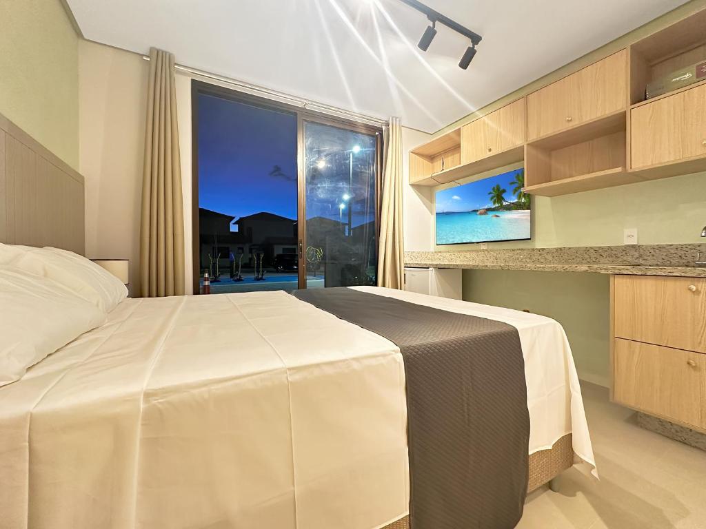 Ένα ή περισσότερα κρεβάτια σε δωμάτιο στο Condomínio Clube - Qto com cozinha - Ar condicionado