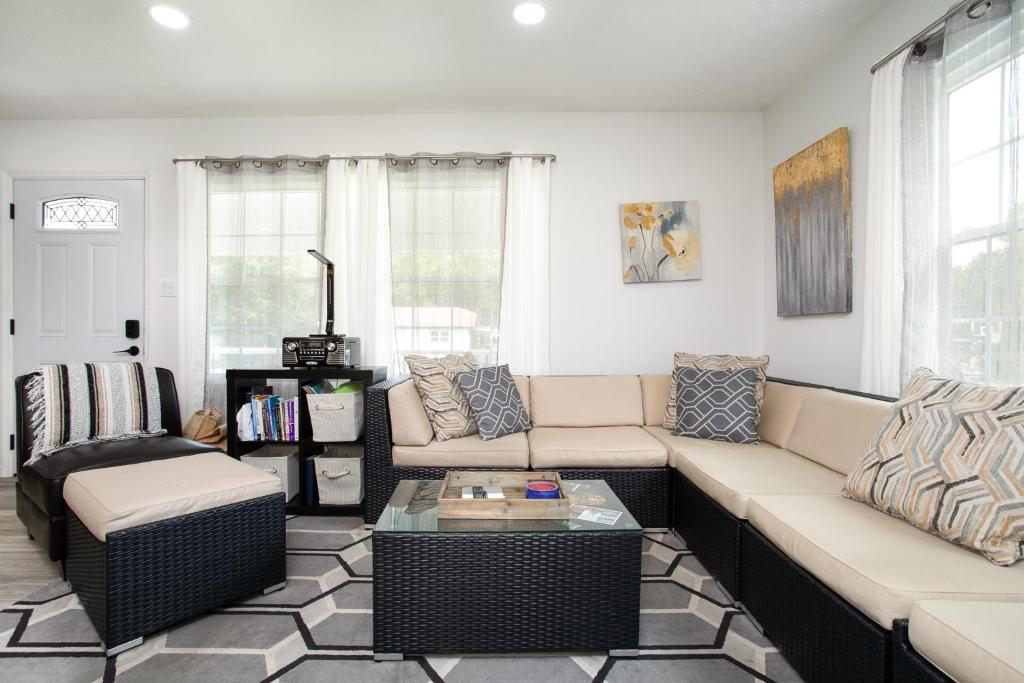 a living room with a couch and a coffee table at Cozy Corner Spacious Area Outdoor Lounges in Knoxville