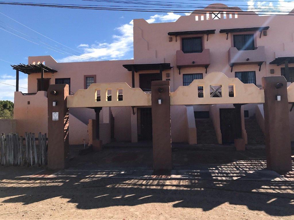 a house in the middle of a desert with a building at El Pueblo A7 Luxury home Condo Great for Couple in Puerto Peñasco
