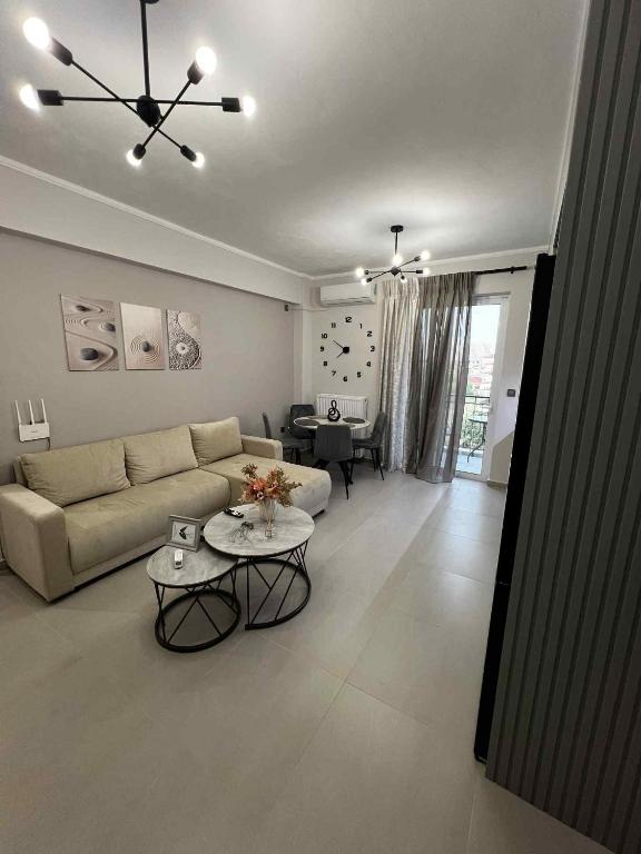 a living room with a couch and a table at L28 apartment in Tripoli