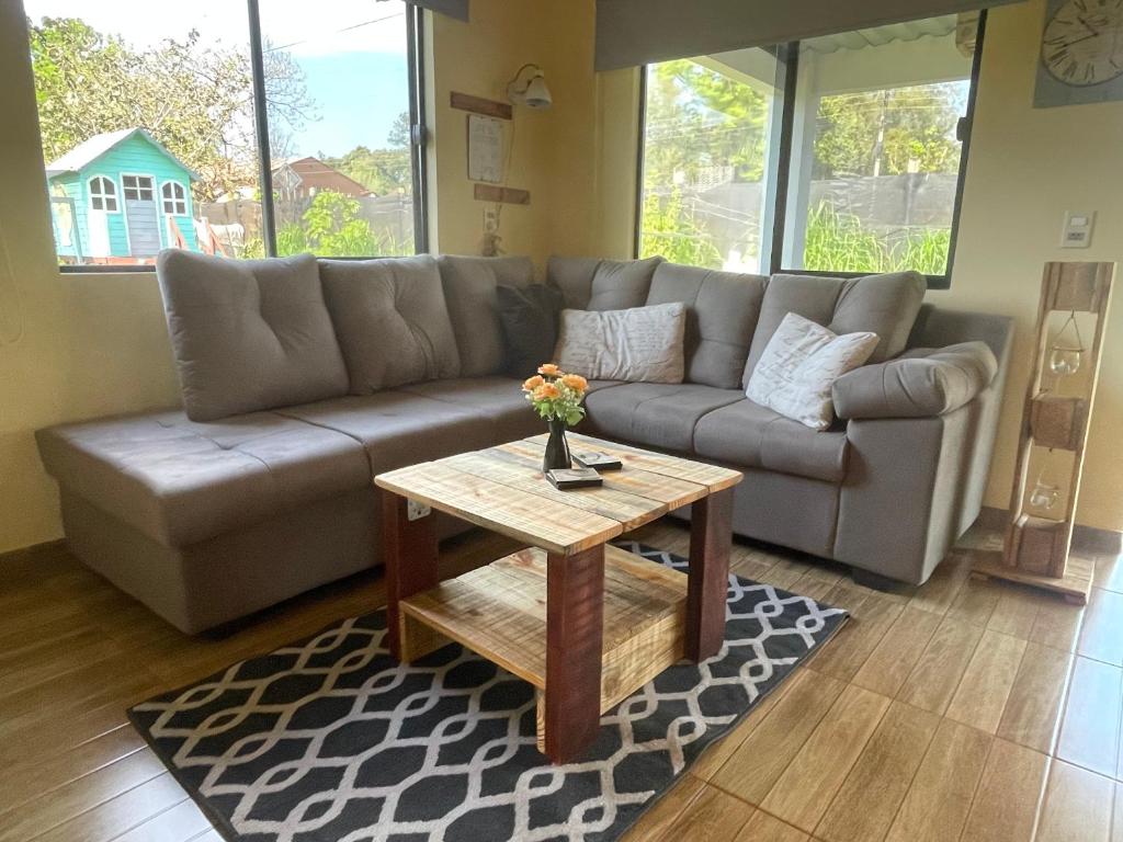 a living room with a couch and a coffee table at Casa Bella Vista 2 Modernes Ferienhaus in Bella Vista