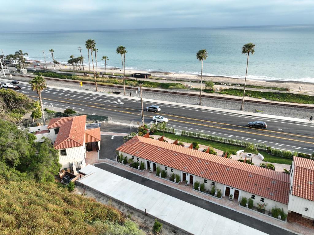 an aerial view of a road and the ocean at El Caminante Bar & Bungalows in Dana Point
