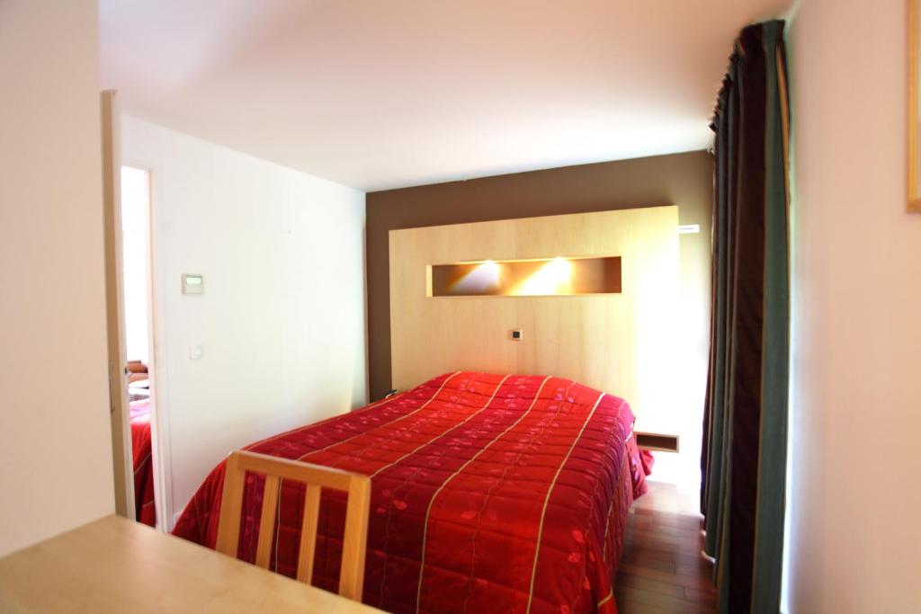 Postel nebo postele na pokoji v ubytování Hôtel la Scala