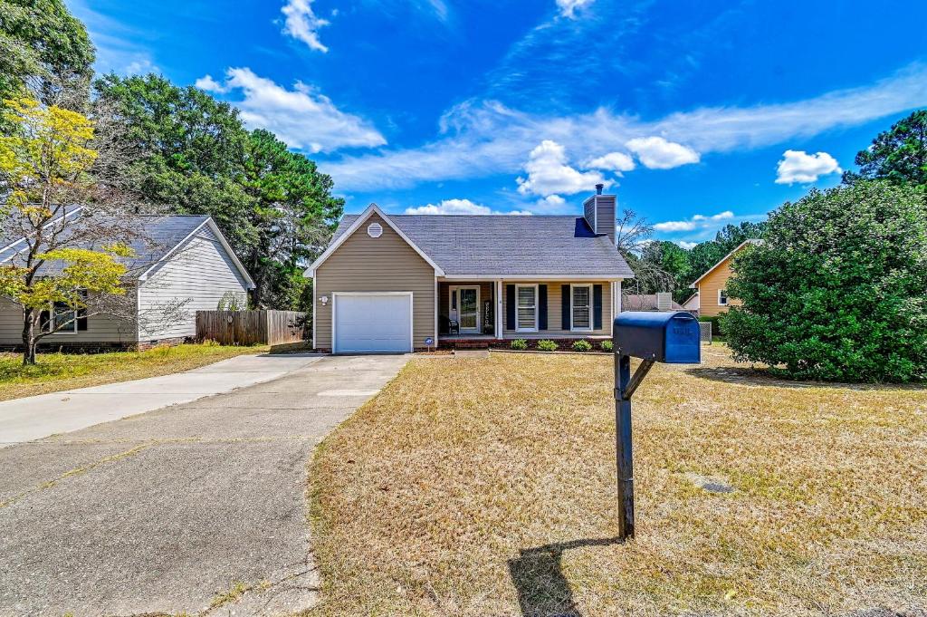 a house with a parking meter in front of it at Large Yard, Office Space Fayetteville Family Home in Hope Mills
