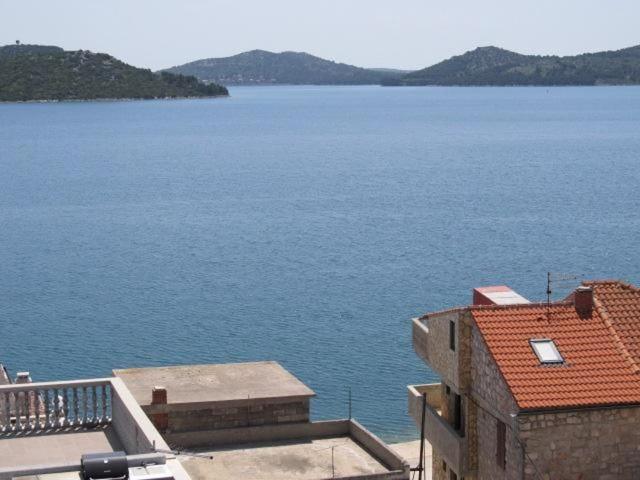 a view of a large body of water from a building at Zeitfenster in Betina