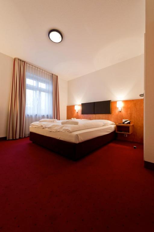 Postel nebo postele na pokoji v ubytování Hotel Neuwirtshaus