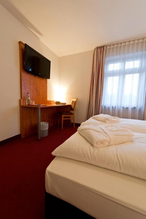 Postel nebo postele na pokoji v ubytování Hotel Neuwirtshaus