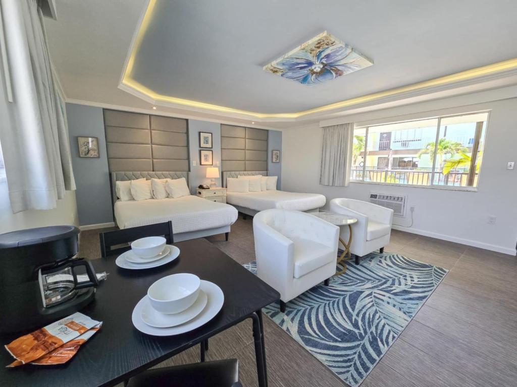 a living room with a couch and a table at Island House Resort Hotel in St Pete Beach