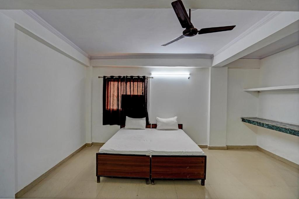 Ένα ή περισσότερα κρεβάτια σε δωμάτιο στο Hotel O Tulip Gold