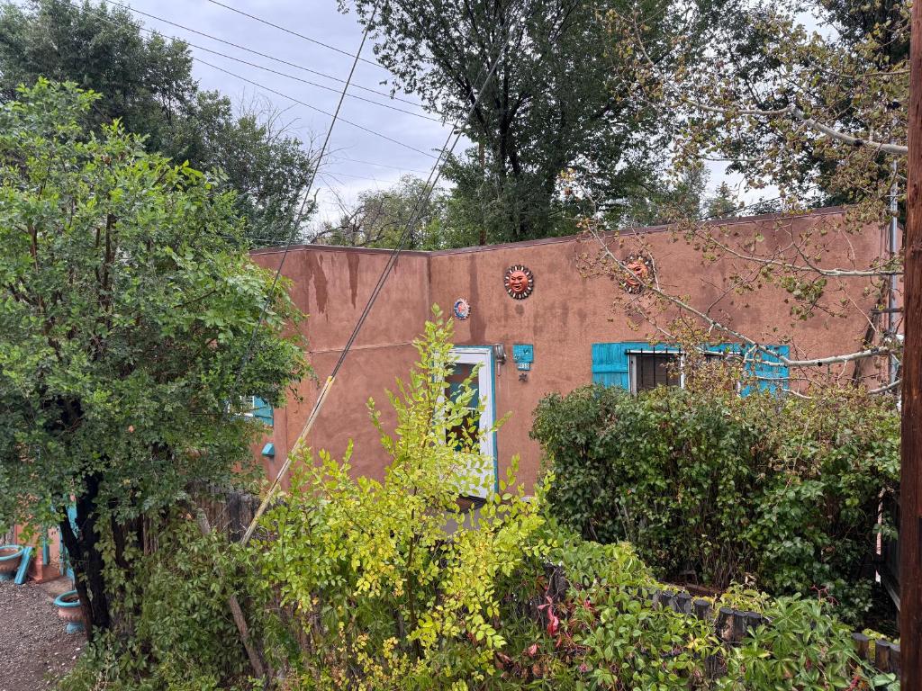 a brown building with a door in the yard at Unique Southwest 2-bedroom home Permit #03015 in Alamosa