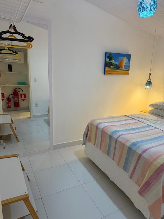 Ein Bett oder Betten in einem Zimmer der Unterkunft Pipa Magnólia Chalés