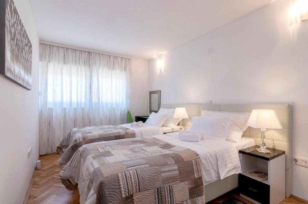 Posteľ alebo postele v izbe v ubytovaní White Residence Accommodation