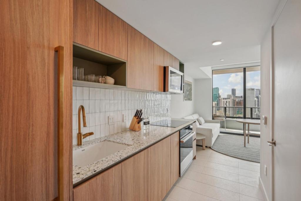 a kitchen with a sink and a counter top at NEW Luxury Bay View Downtown 1 Bedroom in Miami