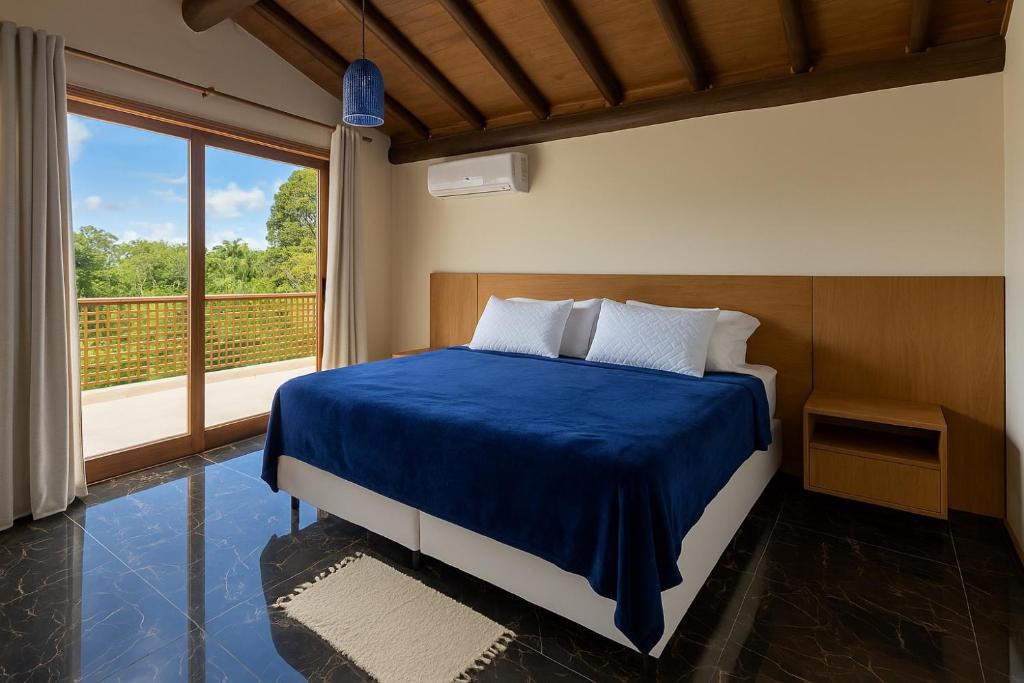 Una cama o camas en una habitación de Casa Ettore Mollo - Trancoso