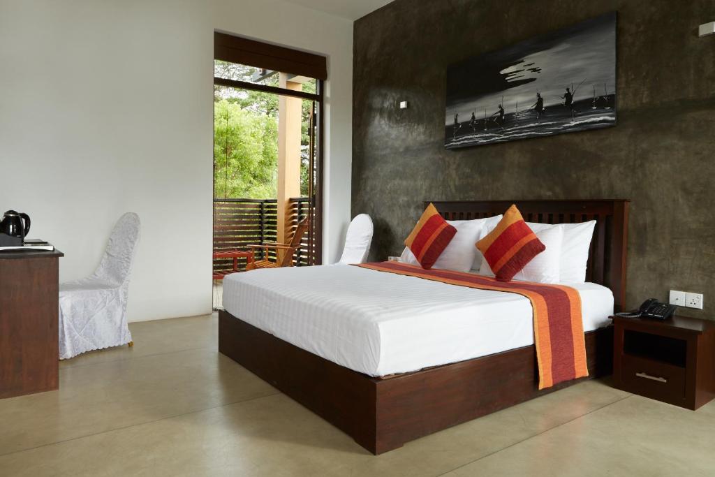 Postel nebo postele na pokoji v ubytování Olanro Hotel Negombo