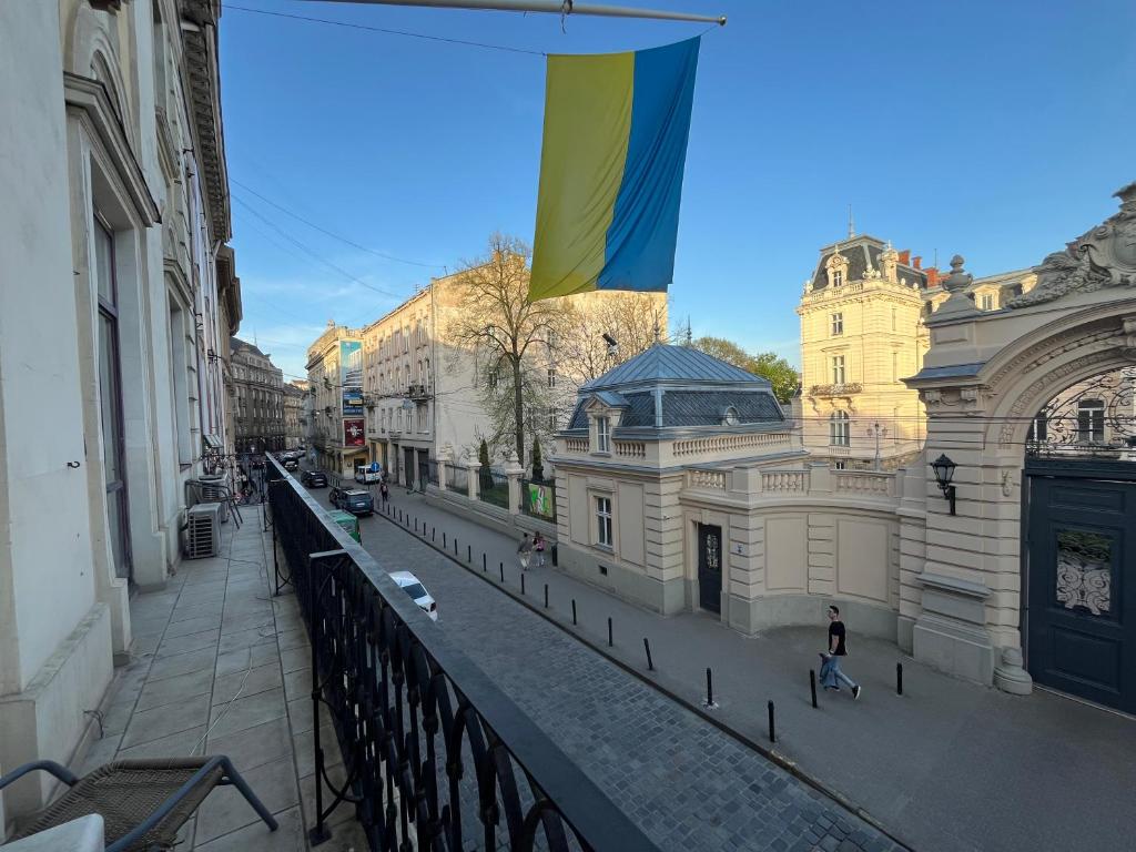 a flag flying over a street in a city at Центрум Апартаментс in Lviv
