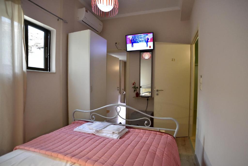 Postel nebo postele na pokoji v ubytování Asimoni Pension