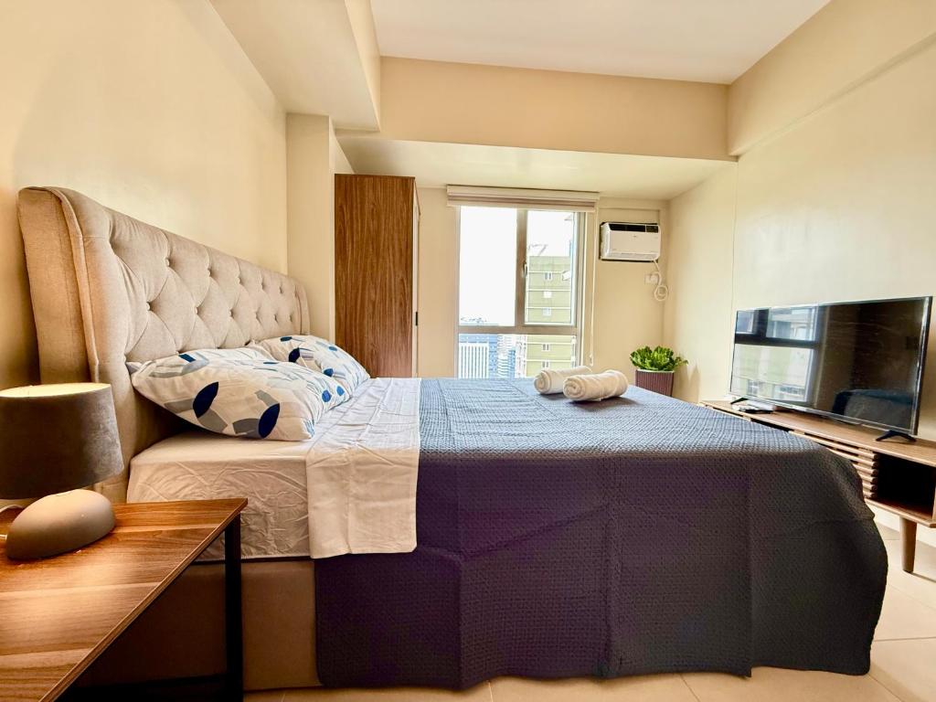 TV a/nebo společenská místnost v ubytování Minimaluxe Studio Condotel By Go2 Stays