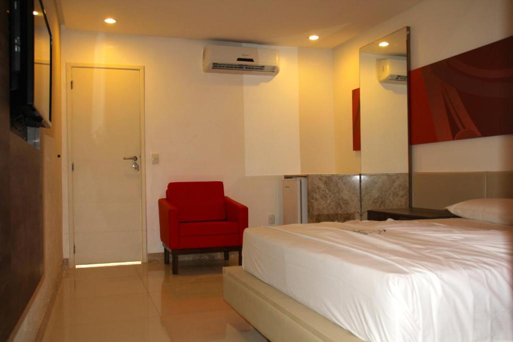 Postel nebo postele na pokoji v ubytování DOM Suites motel (Adult Only)