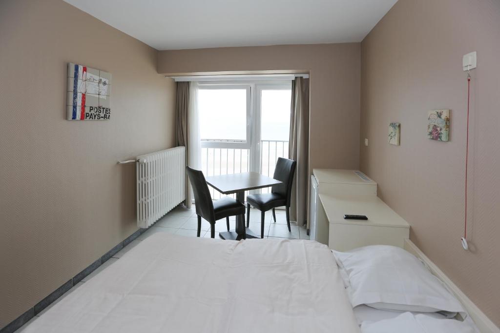 Postel nebo postele na pokoji v ubytování Hotel De Zeebries