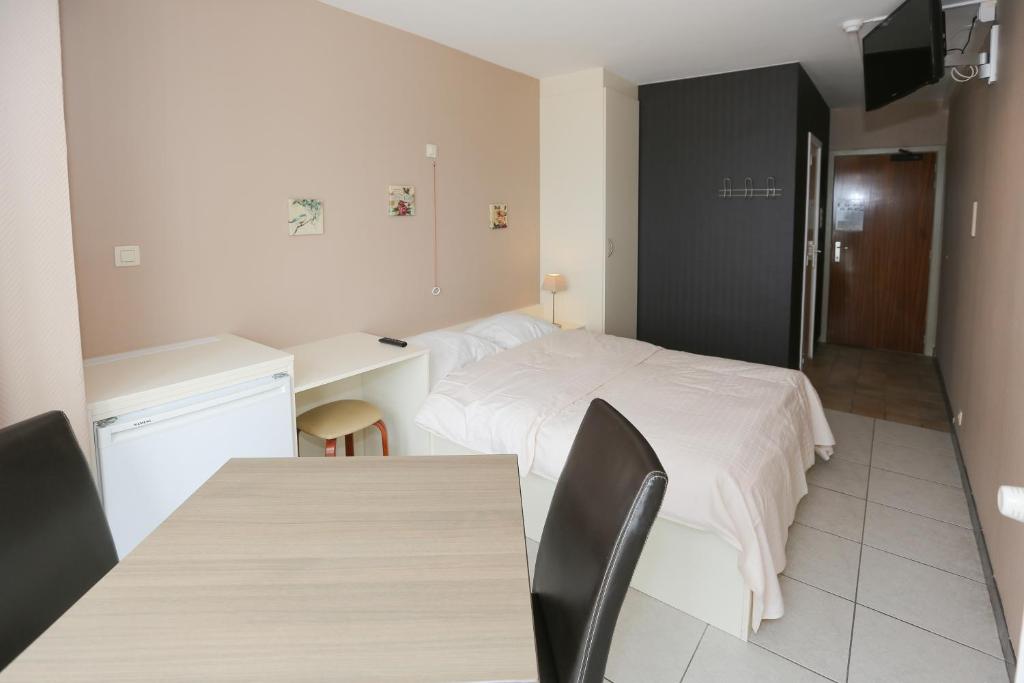 Postel nebo postele na pokoji v ubytování Hotel De Zeebries
