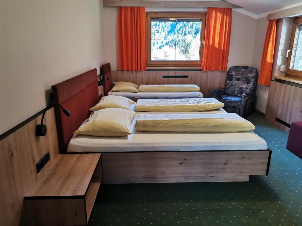 Ένα ή περισσότερα κρεβάτια σε δωμάτιο στο Appartement Mühlau