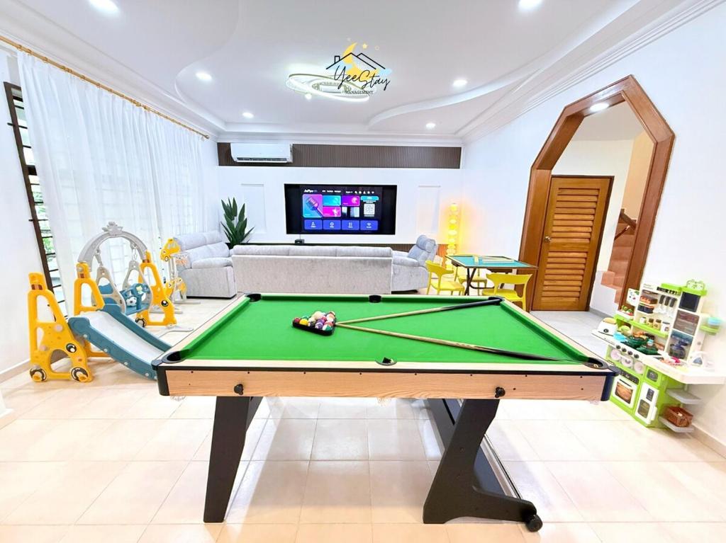 a living room with a pool table at UjongPasir18paxLanded10minstoJonker in Melaka