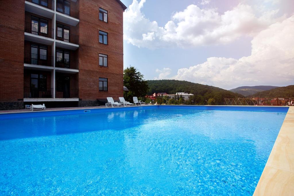 Bazén v ubytování Pansionat Paradiz nebo v jeho okolí