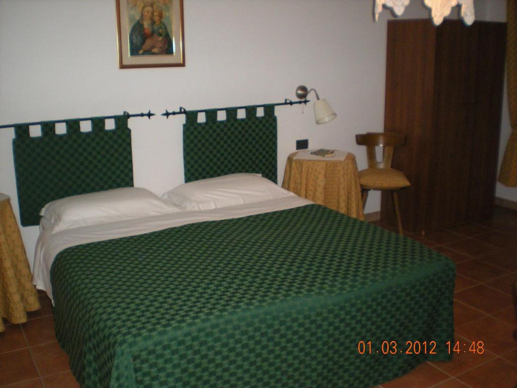 Postel nebo postele na pokoji v ubytování Bike-Hotel Abete