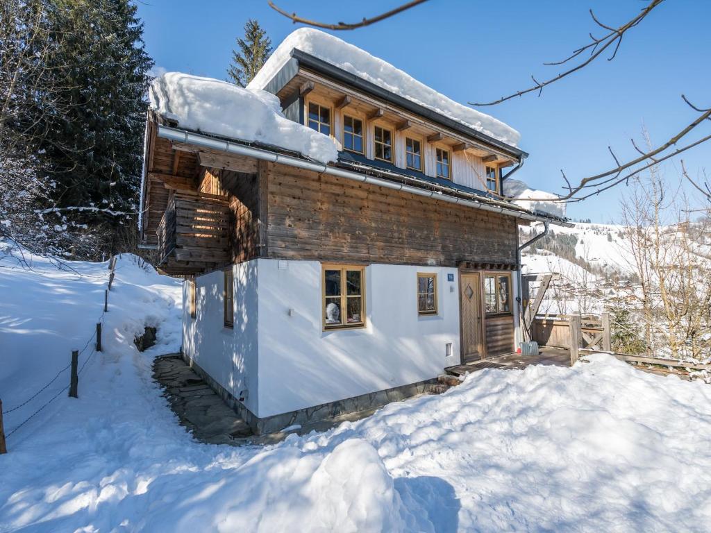 a log cabin in the snow with snow at Chalet with Views, Privacy & Fire in Kaprun in Kaprun