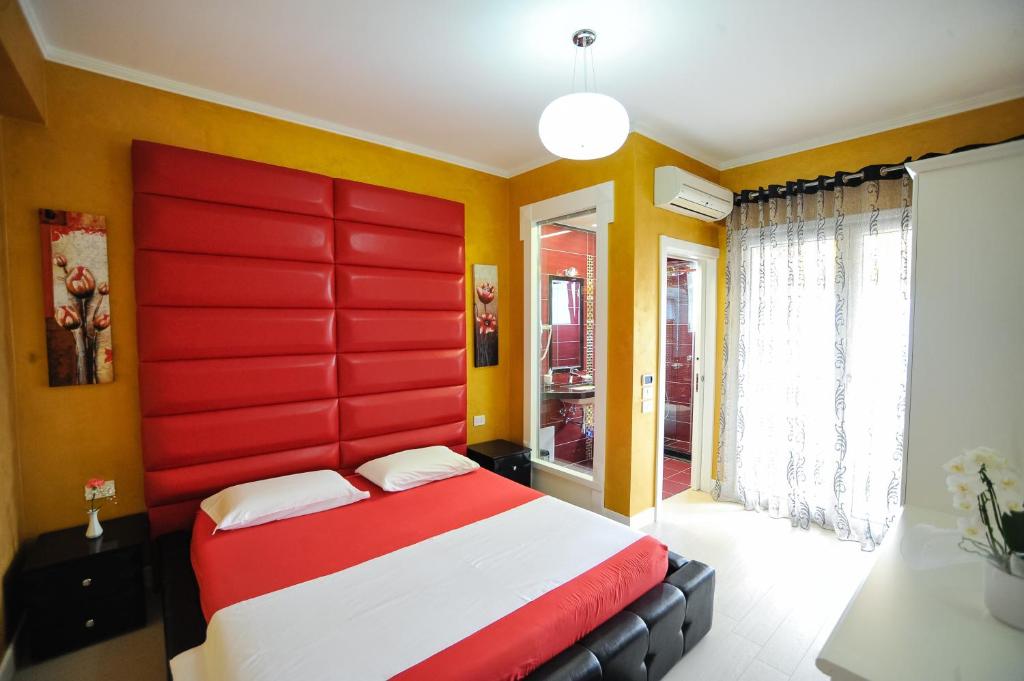 Postel nebo postele na pokoji v ubytování Iliria Internacional Hotel