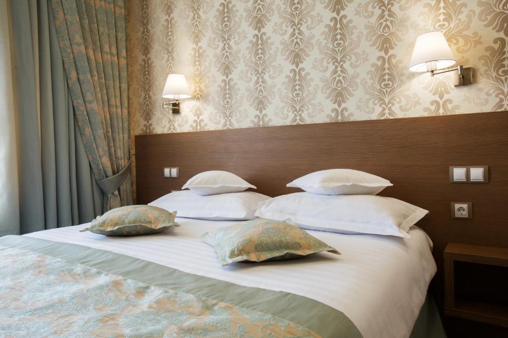 Postel nebo postele na pokoji v ubytování Hotel Stil