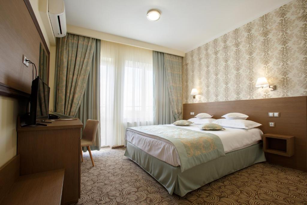 Postel nebo postele na pokoji v ubytování Hotel Stil