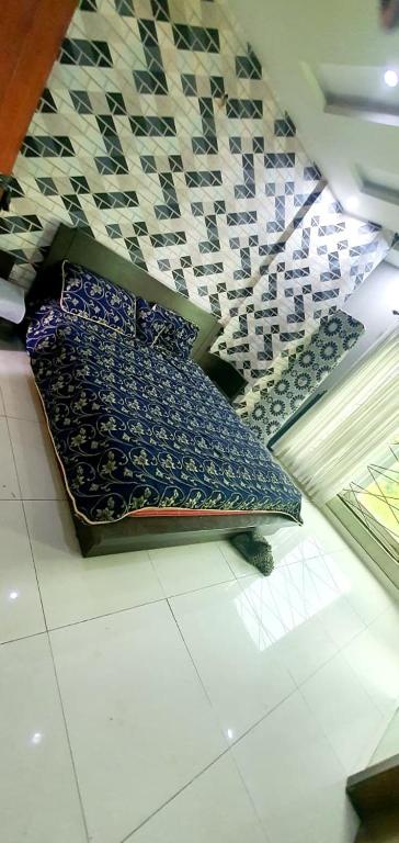 a bench sitting on the floor in a store at Penthouse in Rawalpindi