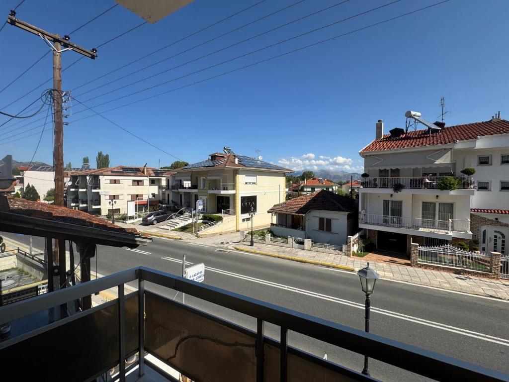 a view of a city street from a balcony at Enoikiazomena Domatia Lazaros in Dispilio