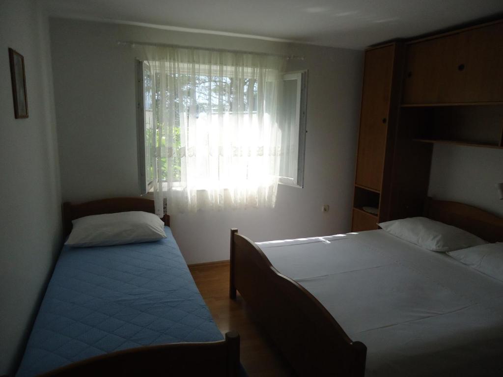 Posteľ alebo postele v izbe v ubytovaní Omiš apartment on the beach