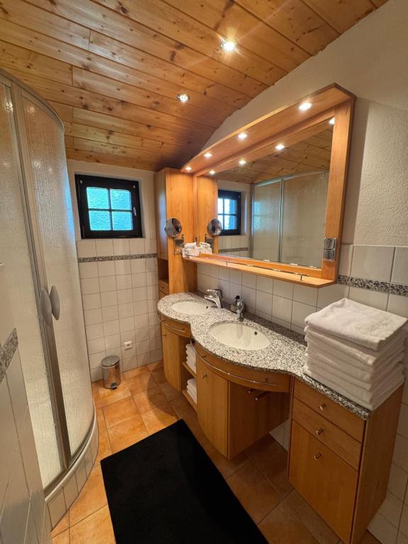 a bathroom with a sink and a mirror at Premium Berglodge Nassfeld - direkt an der Piste in Hermagor