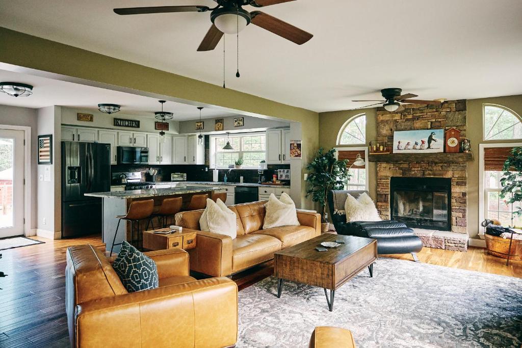 a living room with a couch and a fireplace at Visit Chill House 15 miles from Windham Hot Tub and Ping Pong in Cairo