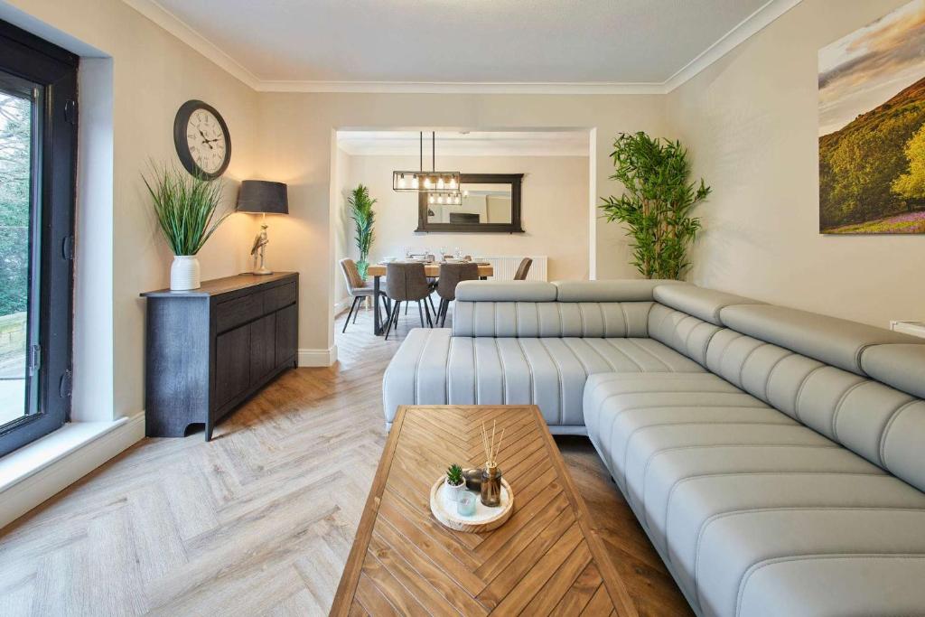 a living room with a couch and a table at Great Ayton Townhouse Retreat-Sleeps 6-3Bed-2Bath in Great Ayton
