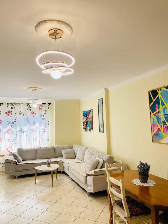 a living room with a couch and a table at Biancas House in Lezhë