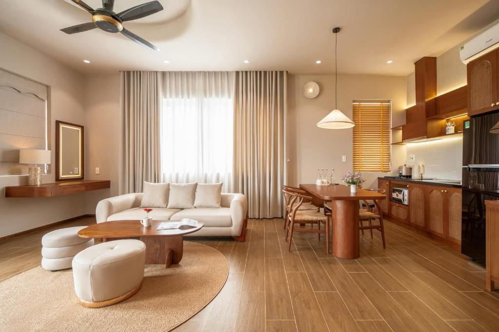 a living room with a couch and a table at JULIE's HOUSE - A LUXURY APARTMENT IN HUE in Hue