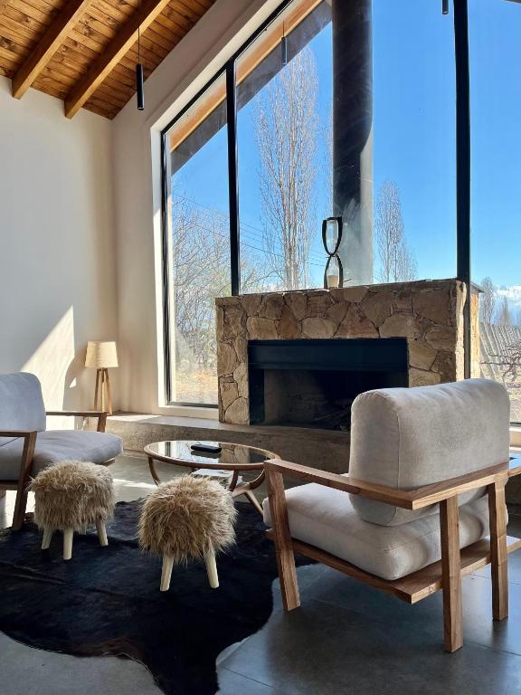 a living room with a couch and a fireplace at Finca Torcivia Luna in Vista Flores